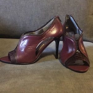 Carlos Santana wine colored peep toe pumps.